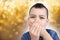 Kid, schoolboy holds his hands on the lower jaw, wrinkles from toothache, the concept of pediatric dentistry, treatment of milk