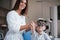 Kid showing something with his forefinger. Child sitting in the doctor`s cabinet and have tested his visual acuity