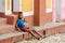 Kid sitting on the stairs in Trinidad, Cuba