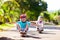 Kid with skateboard. Child riding skate board