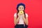 Kid smiling girl ready to eat donut. Sweets shop and bakery concept. Kids huge fans of baked donuts. Impossible to