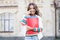 Kid smiling girl school student hold workbooks textbooks for studying. Education for gifted children. Successful pupil