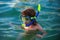 Kid snorkeling in ocean. Diving concept. Child dives into the water. Extreme sport. Kids summer holidays.