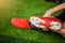 Kid soccer players is sitting with warming on green artificial turf for stretch muscles before and after play soccer game