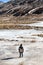 Kid stands on the frozen pond in winter at Zero Point at Lachung. North Sikkim, India