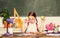 Kid student in school. Schoolgirl sit desk chalkboard background. Girl small child eating apple snack. School break