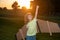 Kid superhero with jetpack. Child pilot play on summer day at sunset. Success, leader and winner concept. Imagination