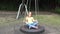 Kid swinging outdoor, child playing at playground, happy smiley girl plays in park, children outdoor