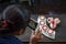 Kid taking photo of beautiful cup cakes flowers from butter cream.