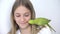 Kid Talk Parrot, Happy Girl Playing her Pet, Child Plays Bird at Home, Funny Indian Ring-Necked Parakeet Birds Cage Family