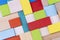 Kid toys background. Colorful Wooden building cubes. Flat lay