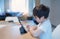 Kid using digital pen writing on tablet,Authentic Young boy using digital pad for his homework, Child studying online zoom video