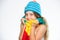 Kid wear warm soft knitted blue hat and long scarf. Warm woolen accessories. Hat and scarf keep warm. Which fabrics will