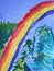 Kids artwork painting colorful fairy tale winter forest with trees and rainbow