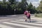 Kids with backpacks walking through pedestrian crossing