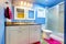 Kids Bathroom with blue walls and pink.