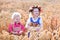 Kids in Bavarian costumes in wheat field