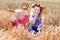 Kids in Bavarian costumes in wheat field