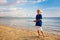 Kids blow bubble at beach. Child with bubbles