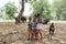 Kids with buffalo and dog on farm in thailand