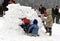 Kids building an igloo (snow house)