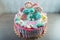 Kids cake decorated with Teddy bear and colorful meringues, marshmallows. Concept of desserts for the birthday children