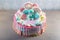 Kids cake decorated with Teddy bear and colorful meringues, marshmallows. Concept of desserts for the birthday children