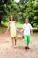 Kids carrying basket of apples