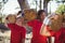 Kids carrying wooden log during obstacle course training