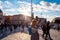 Kids catching and blowing soap bubbles flying on Piazza del Popolo, People Square in Rome full of people, tourists and locals with