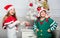 Kids christmas costumes santa and elf. Winter masquerade concept. Siblings ready celebrate christmas or meet new year