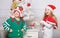 Kids christmas costumes santa and elf. Winter masquerade concept. Siblings ready celebrate christmas or meet new year