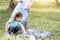 Kids cleaning in park. Volunteer children with a garbage bag cleaning up litter, putting plastic bottle in recycling bag