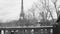 Kids coming back to from school walking on Pont de Bir-Hakeim with Eiffel Tower