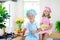 Kids cook in white kitchen. Children cooking