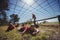 Kids crawling under the net during obstacle course training