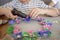 Kids create Easter flower wreath in pastel colors using an upcycled egg trail. Zero waste lifestyle