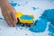 Kids creativity. Kinetic sand games for child development at home. Sand therapy. Boy plays with toy cars.  Selective focus,