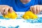 Kids creativity. Kinetic sand games for child development at home. Sand therapy. Children`s hands making moldes. Selective focus,