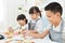 Kids decorating cookies.