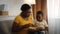 Kids Development. Caring Black Mother Teaching Little Son Reading At Home