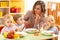 Kids eating healthy food in kindergarten, nursery or at home