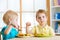 Kids eating in kindergarten or at home