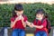 Kids eating outdoors at the school. Healthy school breakfast for children. Sandwich time