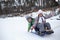 Kids enjoying a sleigh ride on the frozen lake, winter, silence and wild nature, lifestyle