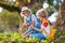 Kids explore nature. Children hike in sunny park