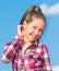 Kids fashion concept. Kid girl checkered fashionable shirt posing sunny day blue sky background. Child cute girl long