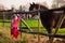 Kids feeding horse on a farm