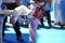 Kids fighting on stage during Taekwondo contest