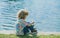 Kids fisher. Child fishing on the lake. Boy with spinner at river. Portrait of excited boy fishing. Boy at jetty with